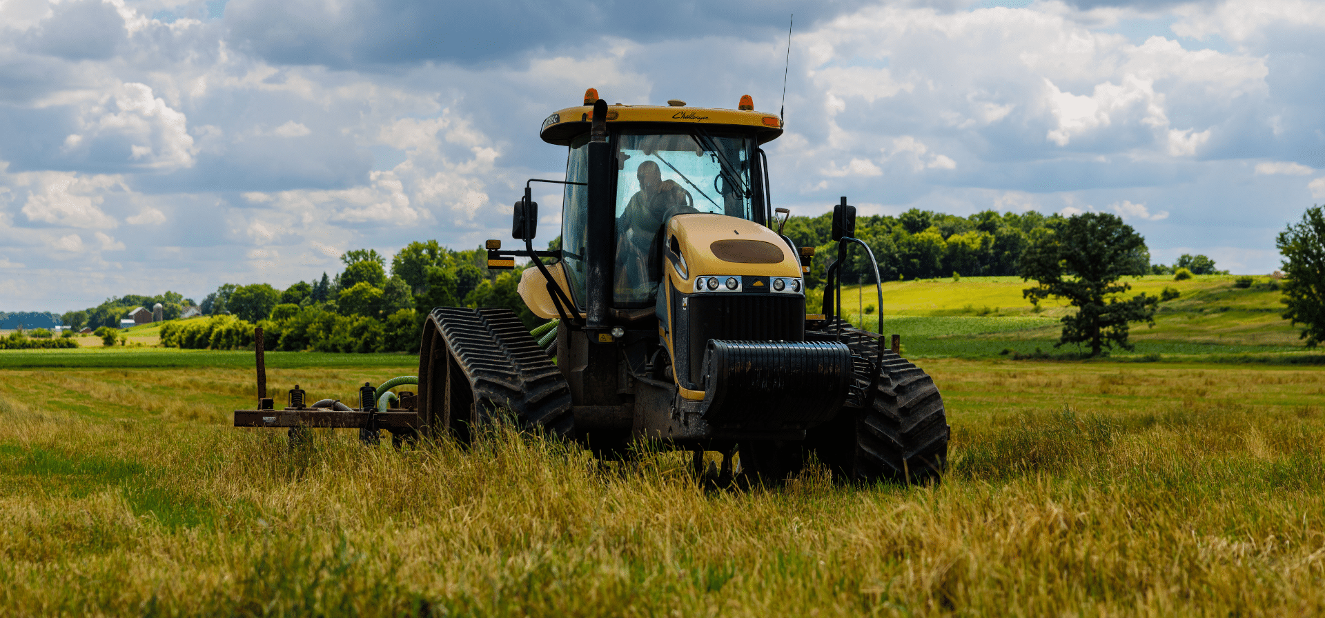 ULWR Land Application with a Tractor in Wisconsin Tractor applying recycled liquid waste material to an agricultural field.