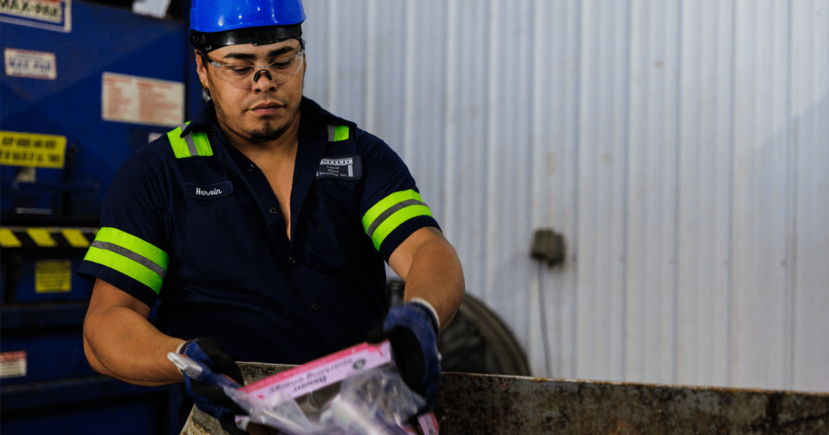 Man sorting recycyled materials.